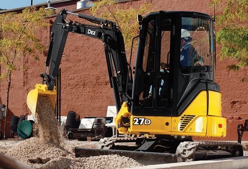 operator using john deere 27d
